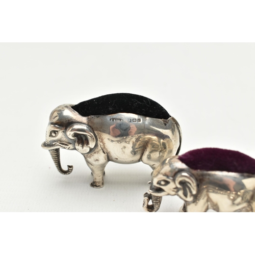 196 - AN EDWARDIAN SILVER ELEPHANT PIN CUSHION, TWO OTHERS AND FOUR SPOONS, realistically stylised elephan... 