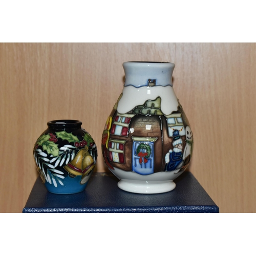 358 - A BOXED MOORCROFT 'CHRISTMAS MORNING' VASE, together with a miniature 'Deck The Bells' pattern vase ... 