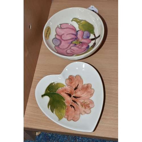 366 - TWO MOORCROFT DISHES, one small dish decorated with a pink magnolia flower on a cream ground, a hear... 