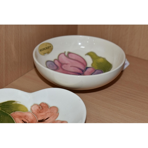 366 - TWO MOORCROFT DISHES, one small dish decorated with a pink magnolia flower on a cream ground, a hear... 