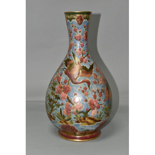 368 - AN ORIENTAL VASE, decorated with pink cranes and blossom on a pale blue ground, outlined in gold gil... 