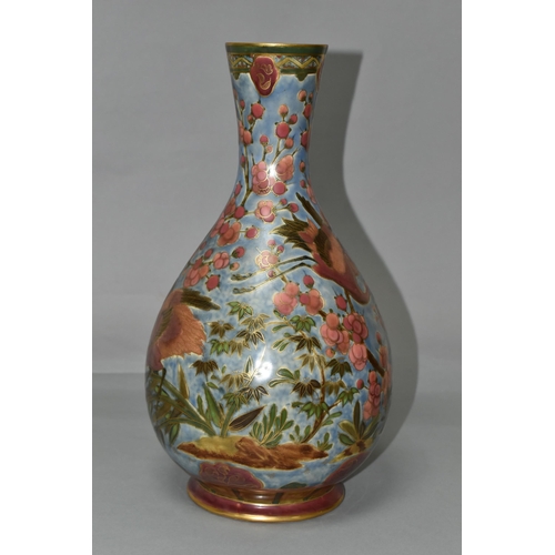 368 - AN ORIENTAL VASE, decorated with pink cranes and blossom on a pale blue ground, outlined in gold gil... 