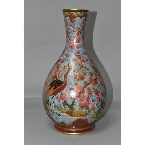 368 - AN ORIENTAL VASE, decorated with pink cranes and blossom on a pale blue ground, outlined in gold gil... 