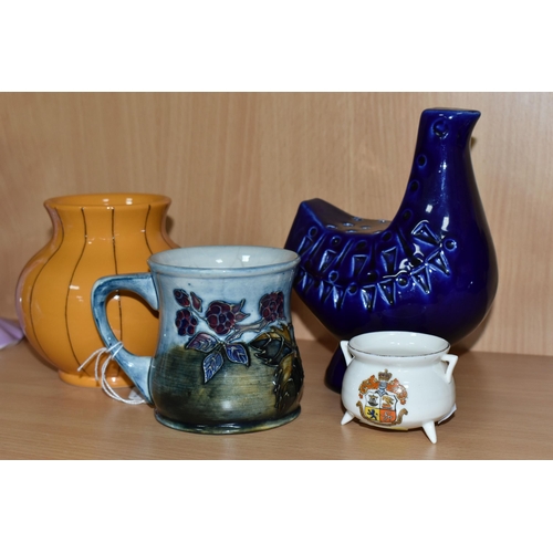 372 - A GROUP OF MOORCROFT POTTERY, comprising a 'Bramble' design mug (cracked and crazed), a Pumpkin vase... 