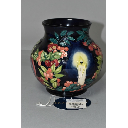 384 - A MOORCROFT POTTERY LIMITED EDITION 'GUIDING LIGHT' VASE, numbered 32/50, tube lined with candles, h... 