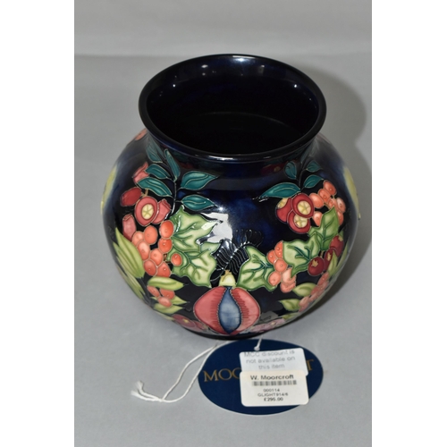 384 - A MOORCROFT POTTERY LIMITED EDITION 'GUIDING LIGHT' VASE, numbered 32/50, tube lined with candles, h... 