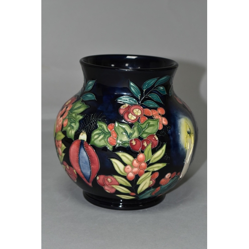 384 - A MOORCROFT POTTERY LIMITED EDITION 'GUIDING LIGHT' VASE, numbered 32/50, tube lined with candles, h... 