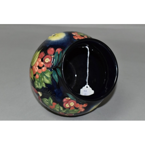 384 - A MOORCROFT POTTERY LIMITED EDITION 'GUIDING LIGHT' VASE, numbered 32/50, tube lined with candles, h... 