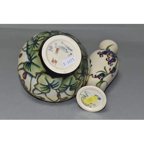 385 - TWO MOORCROFT POTTERY VASES, comprising a bulbous vase in the 'Hepatica' pattern, tube lined with li... 