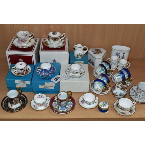 387 - A COLLECTION OF MINIATURE CUPS AND SAUCERS, ETC, to include boxed teacups in Royal Albert Old Countr... 