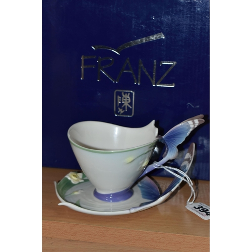 394 - A BOXED FRANZ PORCELAIN TEACUP AND SAUCER, in the Blue Butterfly pattern FZ00056 (2 + box) (Conditio... 