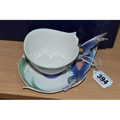 394 - A BOXED FRANZ PORCELAIN TEACUP AND SAUCER, in the Blue Butterfly pattern FZ00056 (2 + box) (Conditio... 