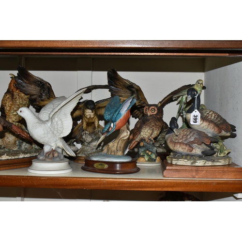 399 - TWELVE BIRD AND ANIMAL SCULPTURES, to include geese, pheasants, budgies, owls, birds of prey and an ... 