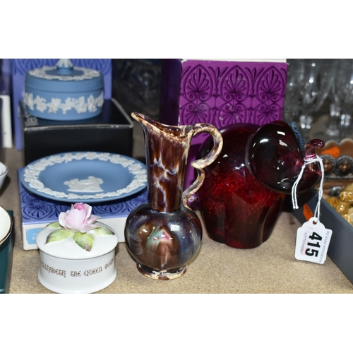 415 - A GROUP OF CERAMIC ORNAMENTS AND GLASSWARE, comprising a boxed Wedgwood red glass elephant, eight bo... 