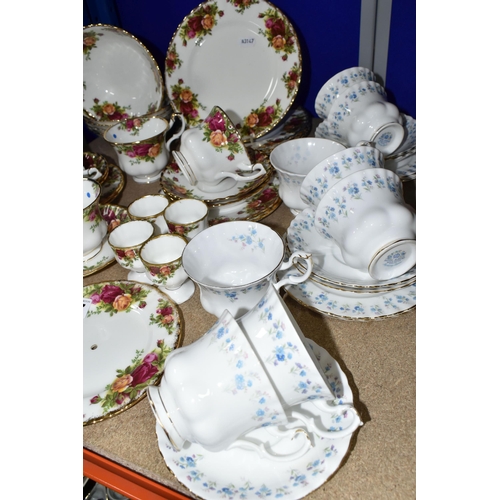 427 - TWO ROYAL ALBERT TEA SETS, 'MEMORY LANE' AND 'OLD COUNTRY ROSES' PATTERNS, comprising eight cups, fi... 