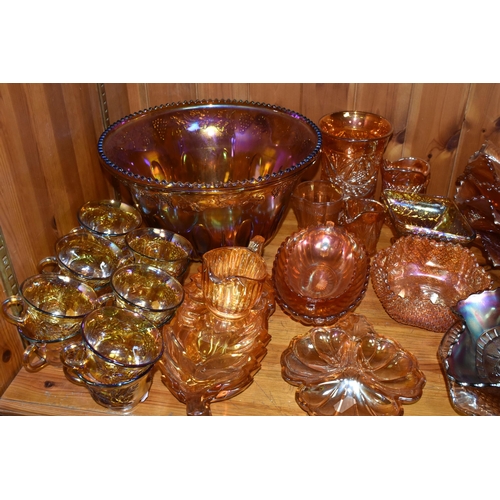 454 - A COLLECTION OF CARNIVAL GLASS, over forty pieces to include a punch bowl and cups, bowls, jugs, and... 