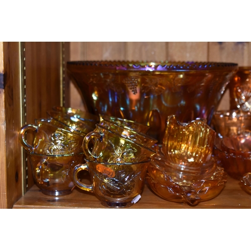 454 - A COLLECTION OF CARNIVAL GLASS, over forty pieces to include a punch bowl and cups, bowls, jugs, and... 