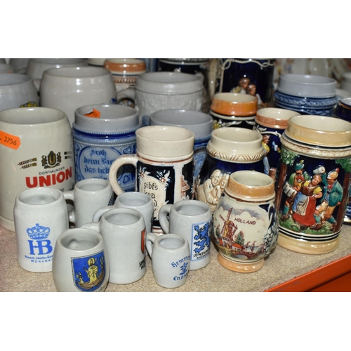 469 - A COLLECTION OF STEINS AND CERAMIC TANKARDS, thirty two pieces to include salt glazed stoneware exam... 