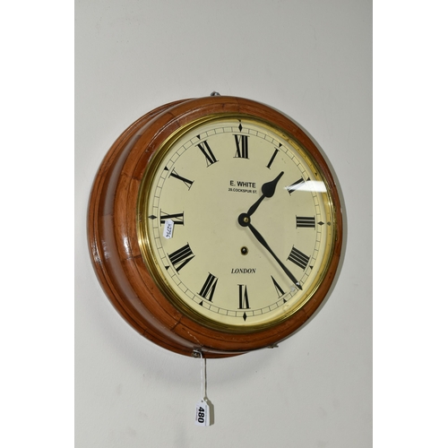 480 - A CIRCULAR WOODEN CASED WALL CLOCK, painted metal dial with black Roman numerals and glass door, cas... 