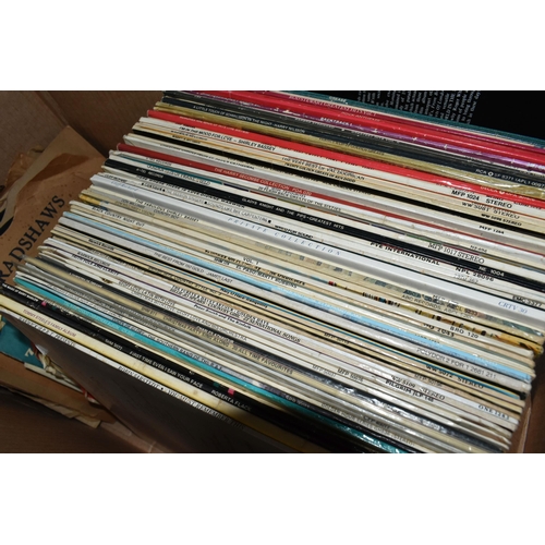 488 - FOUR TRAYS CONTAINING OVER TWO HUNDRED LPs, 78s AND 12in SINGLES mostly easy listening as well as 19... 