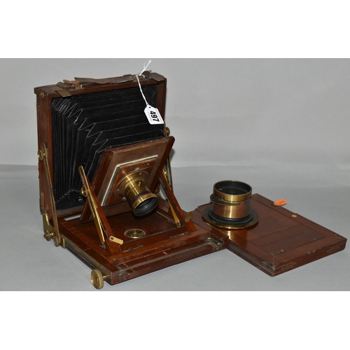 497 - AN O.F.S.ROTHWELL MAHOGANY AND BRASS FIELD CAMERA with a replacement lens plate holding a Busch's Ra... 