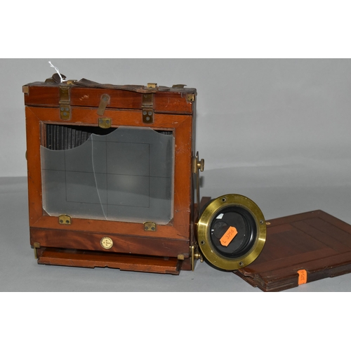 497 - AN O.F.S.ROTHWELL MAHOGANY AND BRASS FIELD CAMERA with a replacement lens plate holding a Busch's Ra... 