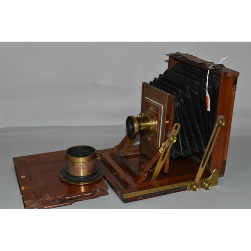 497 - AN O.F.S.ROTHWELL MAHOGANY AND BRASS FIELD CAMERA with a replacement lens plate holding a Busch's Ra... 