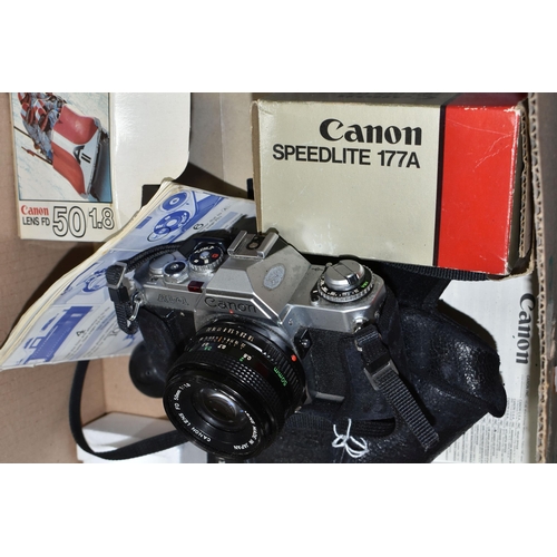 499 - A CANON AV-1 FILM SLR CAMERA, a boxed FD 50mm f1.8 lens, a Speedlite 177A etc