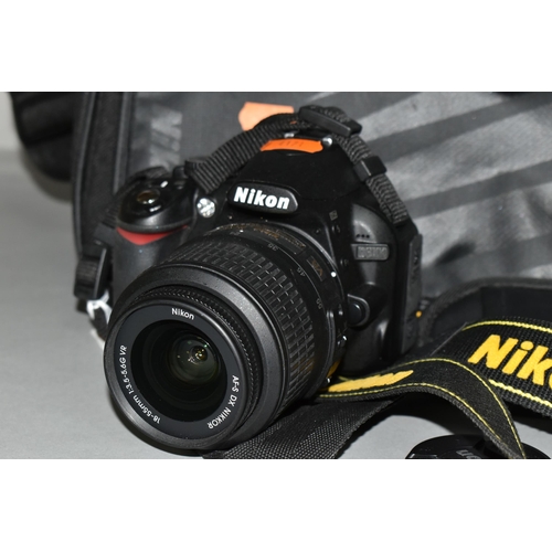 501 - A NIKON D3100 DIGITAL SLR CAMERA fitted with a DF-S DX Nikkor 18-55mm f3.5 lens, one battery and cha... 