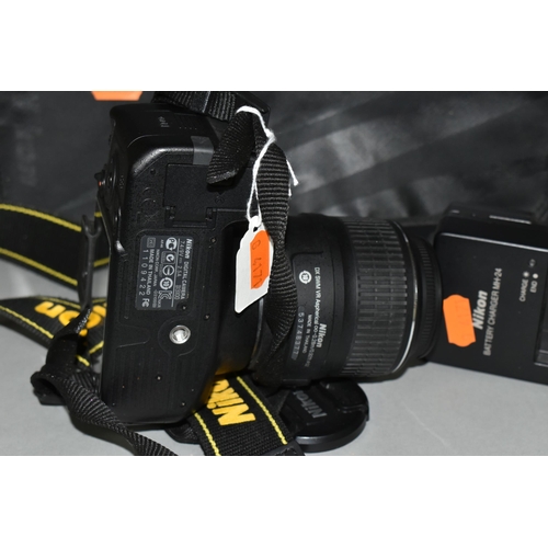 501 - A NIKON D3100 DIGITAL SLR CAMERA fitted with a DF-S DX Nikkor 18-55mm f3.5 lens, one battery and cha... 