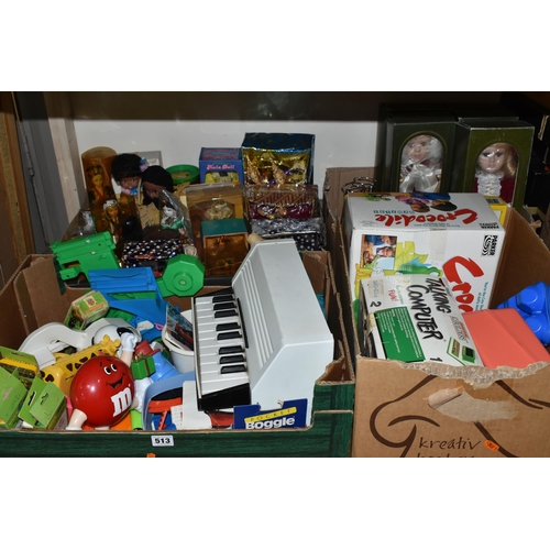 513 - FOUR BOXES OF TOYS AND SOUVENIR DOLLS, to include six Palitoy 'Pocketeers' games, a collection of tr... 