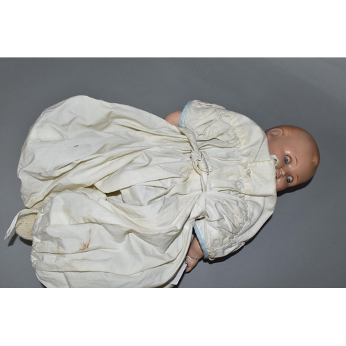 526 - A HUGO WIEGARD DOLL, with bisque head, closing eyes, an open mouth showing two teeth, composite body... 