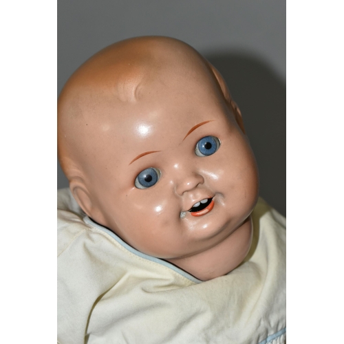 526 - A HUGO WIEGARD DOLL, with bisque head, closing eyes, an open mouth showing two teeth, composite body... 