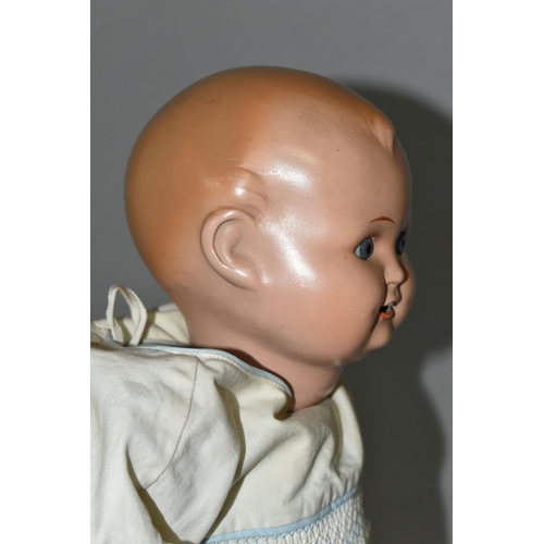 526 - A HUGO WIEGARD DOLL, with bisque head, closing eyes, an open mouth showing two teeth, composite body... 