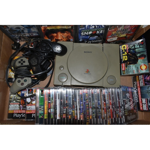 529 - A PLAYSTATION CONSOLE WITH GAMES AND DEMO DISCS, includes demos for Crash Bandicoot 2, Crash Bandico... 