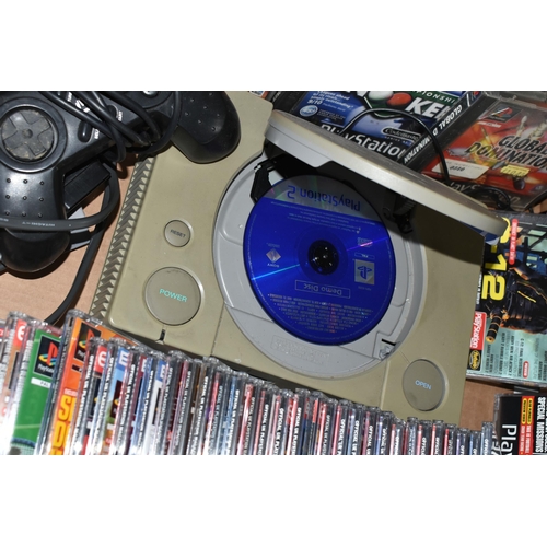 A PLAYSTATION CONSOLE WITH GAMES AND DEMO DISCS, includes demos for ...