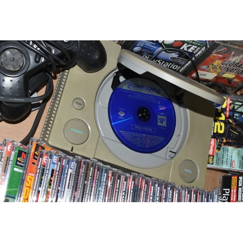 529 - A PLAYSTATION CONSOLE WITH GAMES AND DEMO DISCS, includes demos for Crash Bandicoot 2, Crash Bandico... 