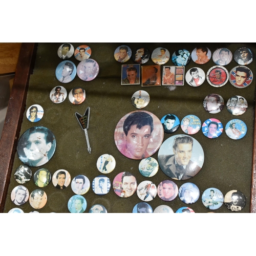 539 - A COLLECTION OF ELVIS MEMORABILIA, including approximately sixty badges within a stained pine frame,... 