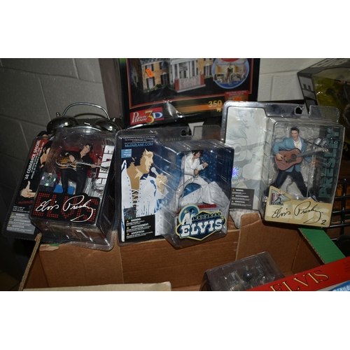 554 - TWO BOXES OF ELVIS PRESLEY MEMORABILIA ETC, to include a boxed set of three action figures, six sing... 