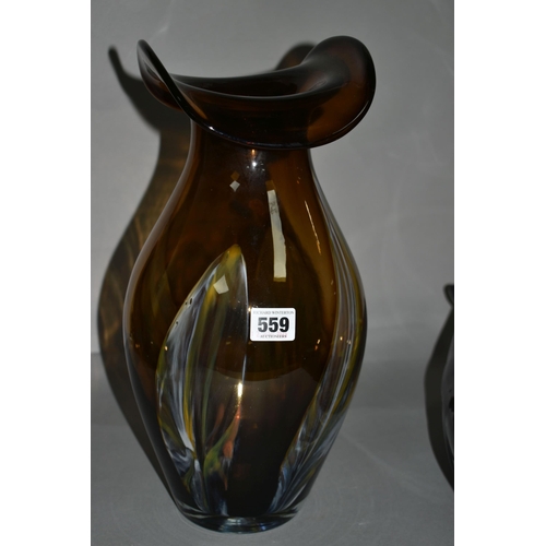 559 - TWO PIECES OF ART GLASS, comprising a large brown art glass vase decorated with green, white and red... 