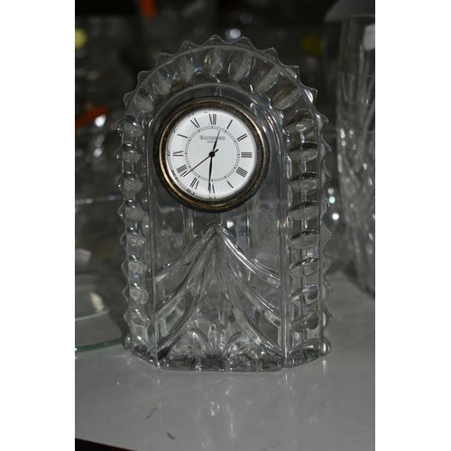 592 - A GROUP OF CUT GLASS DECANTERS AND WATERFORD CRYSTAL, comprising a Waterford Crystal mantel clock, a... 