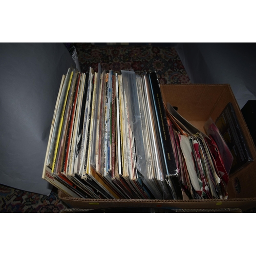 599 - THREE BOXES OF ELVIS PRESLEY LPs, TAPE CASSETTES, 45RPM AND 45E.P RECORDS, over one hundred assorted... 