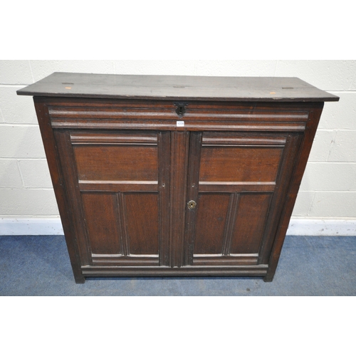 1309 - A PART 17TH CENTURY OAK WAINSCOT CUPBOARD, with a half hinged compartment to the top, double panelle... 