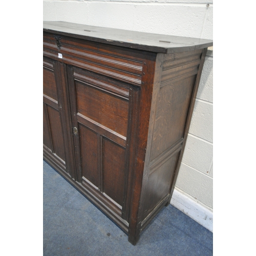 1309 - A PART 17TH CENTURY OAK WAINSCOT CUPBOARD, with a half hinged compartment to the top, double panelle... 