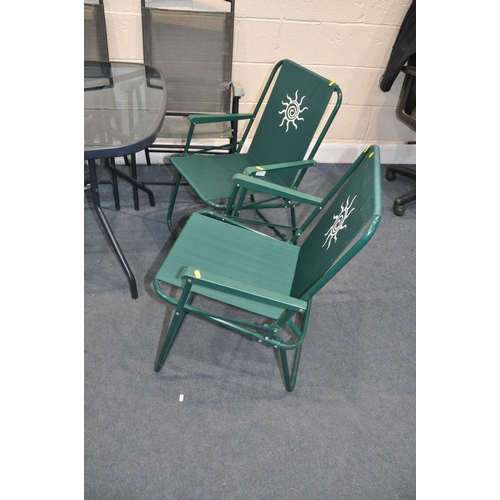 1115 - A HOMEBASE GLASS TOPPED GARDEN TABLE with three matching chairs and two other folding chairs