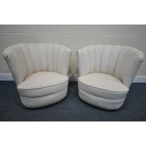 1201 - A PAIR OF ART DECO CREAM LEATHER CLOUD CHAIRS, on casters (condition report report:-leather finish f... 