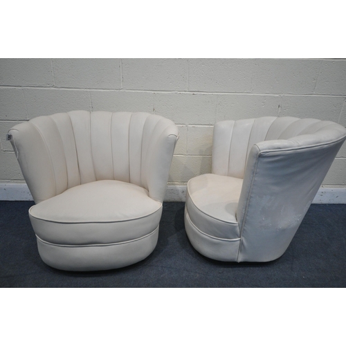 1201 - A PAIR OF ART DECO CREAM LEATHER CLOUD CHAIRS, on casters (condition report report:-leather finish f... 