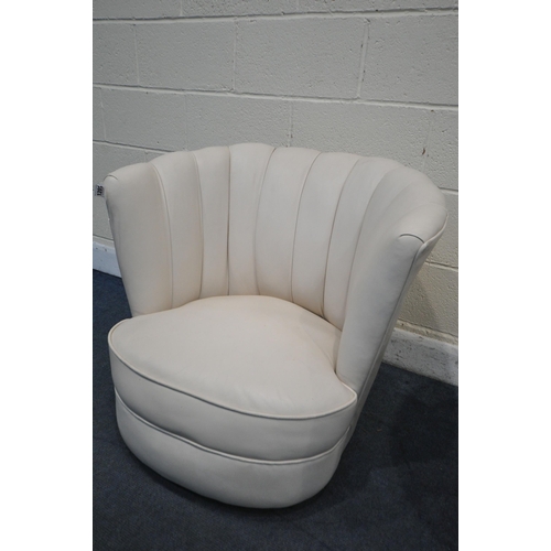 1201 - A PAIR OF ART DECO CREAM LEATHER CLOUD CHAIRS, on casters (condition report report:-leather finish f... 