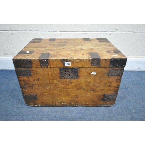 1202 - A VINTAGE PINE AND METAL BANDED TRUNK, with metal handles, width 61cm x depth 42cm x height 37cm (co... 