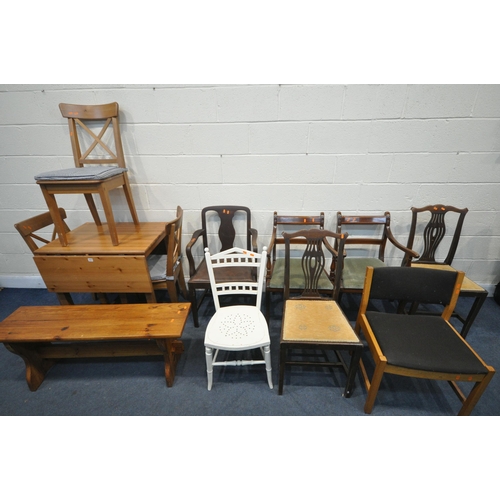 1277 - A MODERN PINE DROP LEAF TABLE, with three pine chairs, a pine bench, along with seven various chairs... 